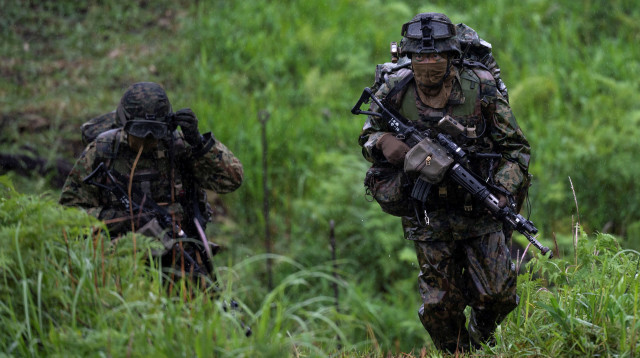 חיילי צבא ארצות הברית (צילום: Charly Triballeau/Pool via REUTERS)