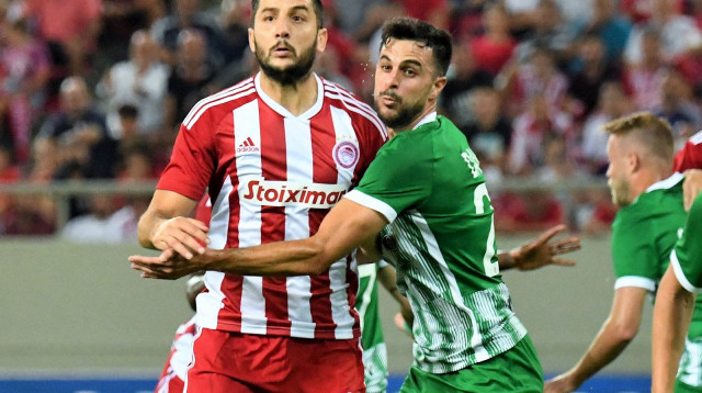 דין דוד מול קוסטאס מנולאס (צילום: אתר רשמי, ראובן כהן, מכבי חיפה)