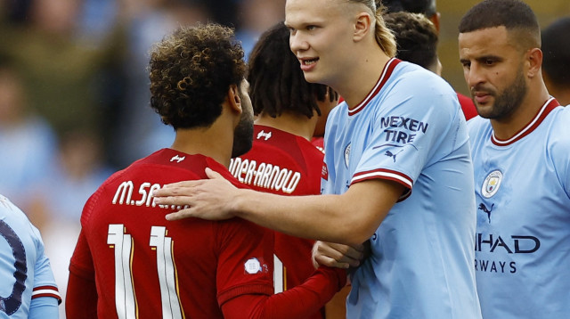 ארלינג הולאנד שחקן מנצ'סטר סיטי עם מוחמד סלאח שחקן ליברפול (צילום: רויטרס)