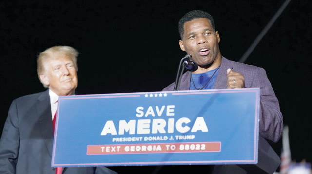 הרשל ווקר וטראמפ  (צילום: Sean Rayford Getty Images)