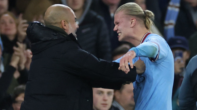 ארלינג הולאנד, שחקן מנצ'סטר סיטי, עם פפ גווארדיולה (צילום: רויטרס)