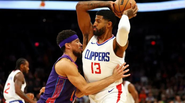 הקליפרס לוהטים. פול ג'ורג' מול דווין בוקר (צילום: רויטרס)