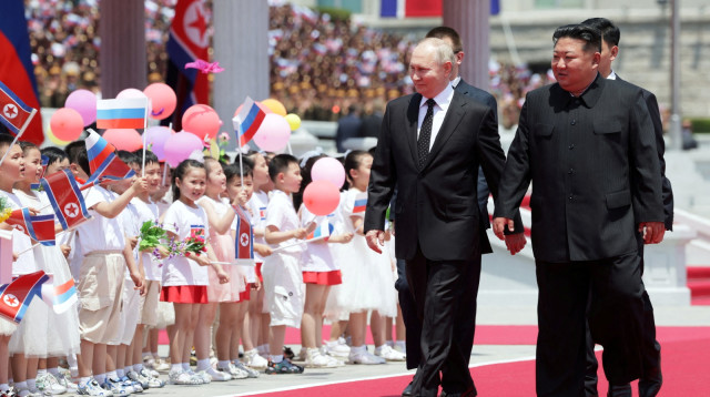 ולדימיר פוטין, קים ג'ונג און (צילום: Sputnik/Gavriil Grigorov/Pool via REUTERS)