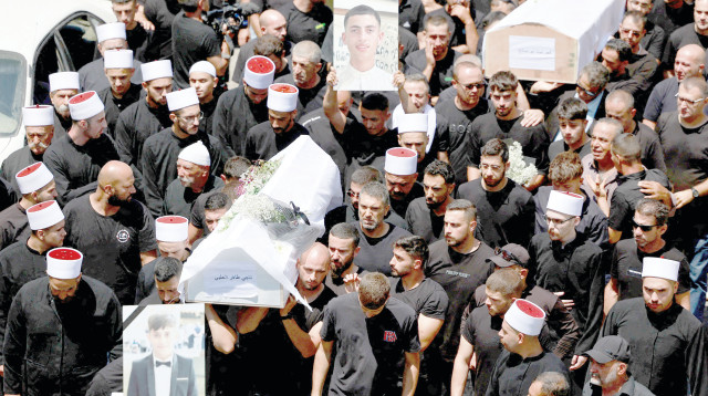 הלווית הילדים במג'דל שמס  (צילום: רויטרס)