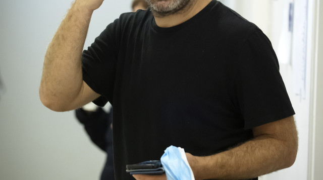 חנוך דאום (צילום:   Andy Rain - Pool/Getty Images, Moshe Shai/FLASH90)