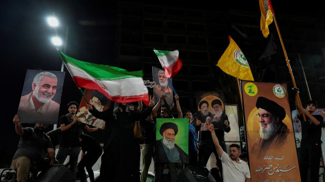 חגיגות לאחר המתקפה האיראנית על ישראל (צילום: REUTERS/Essam al-Sudani)