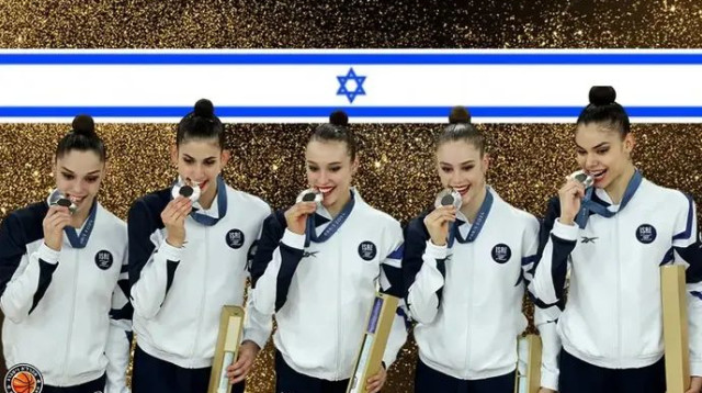 בתוך הזכייה מסתתרת המדליסטית הצעירה אי פעם. ההתעמלות האומנותית (צילום: GettyImages, עיבוד: אהרל'ה ויסברג)