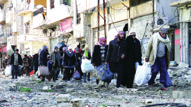 פליטים בחומס, סוריה (צילום: רויטרס)