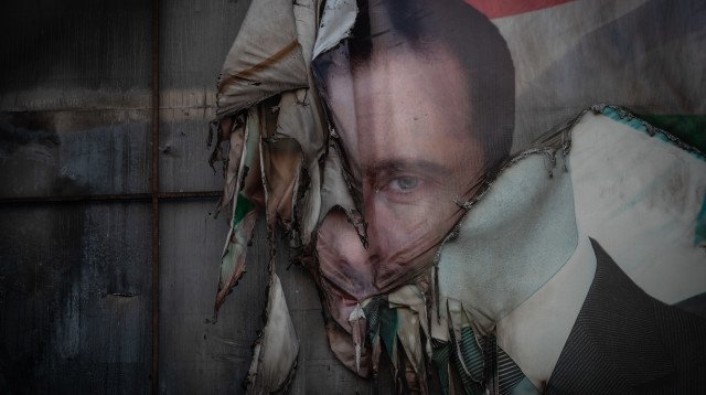 פוסטר של בשאר אל-אסד (צילום: Burak Kara/Getty Images)