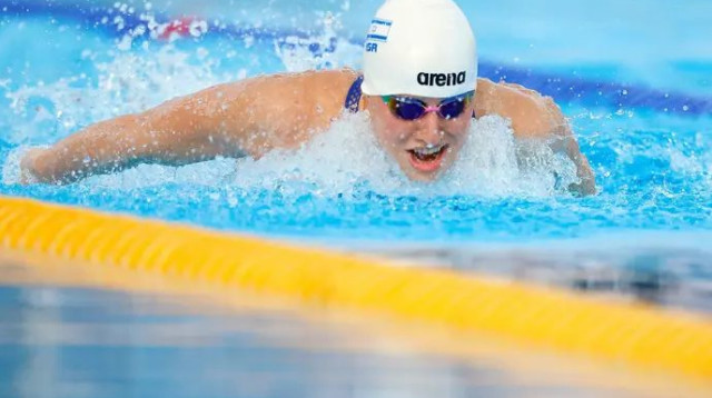 "הרגשה שאי אפשר לתאר במילים". פולונסקי (צילום: אתר רשמי, סימונה קאסטרווילארי, איגוד השחייה)