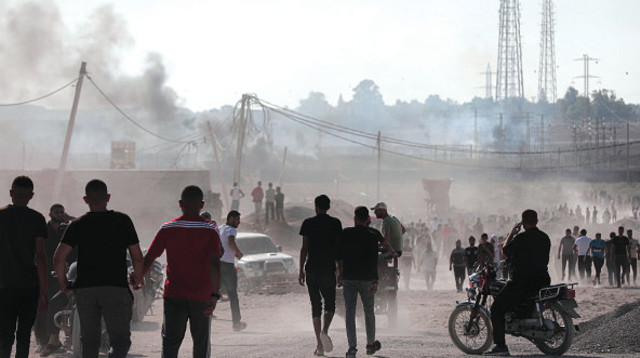 פושטים על נחל עוז (צילום: Momen Faiz NurPhoto via Getty Images)