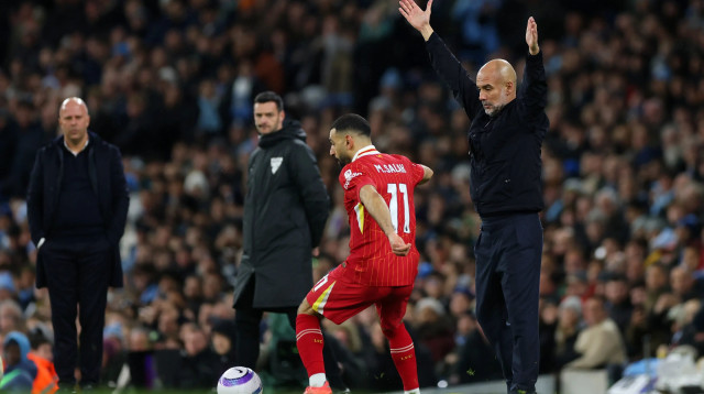 מוחמד סלאח לצד פפ גווארדיולה (צילום: GettyImages, Alex Pantling)