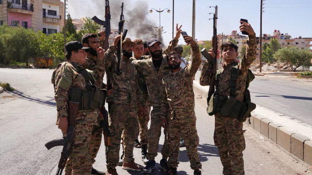 מיליציות של דאע"ש בסוויידה שבסוריה (צילום: רשתות ערביות)