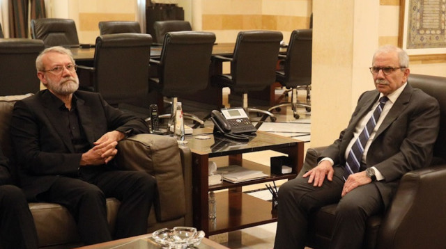 עלי לאריג'אני ונוואף סלאם (צילום: צילום מסך רשתות ערביות)