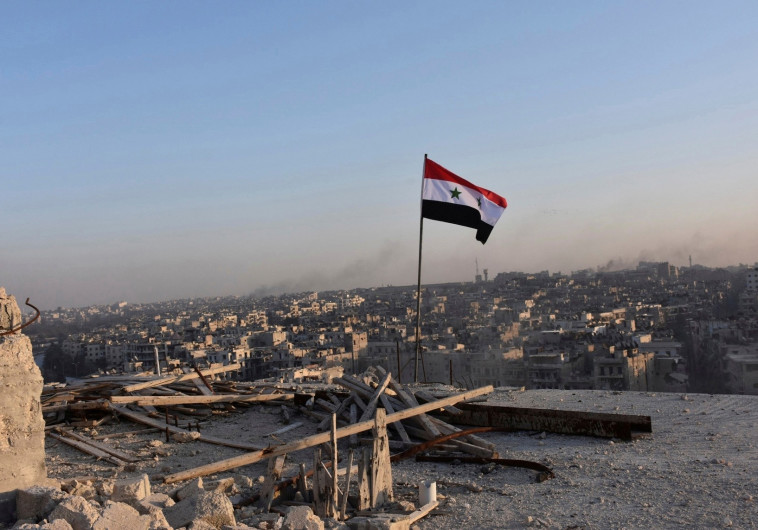  דגל סוריה בחאלב. צילום: רויטרס