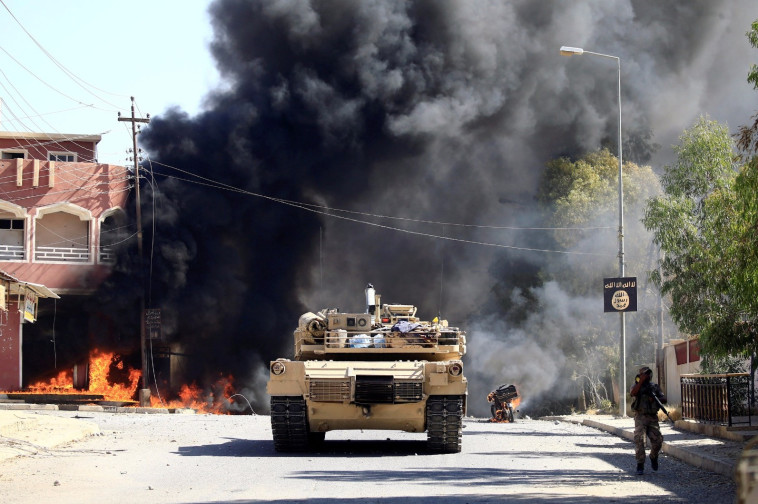 לחימה בין הצבא העיראקי לדאעש בתל עפאר. צילום: רויטרס
