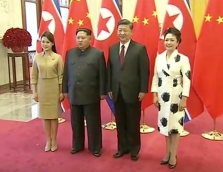 קים עם נשיא סין ונשותיהם. צילום: רויטרס