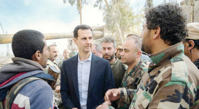 בשאר אסד במפגש עם חיילי צבא סוריה. צילום: רויטרס