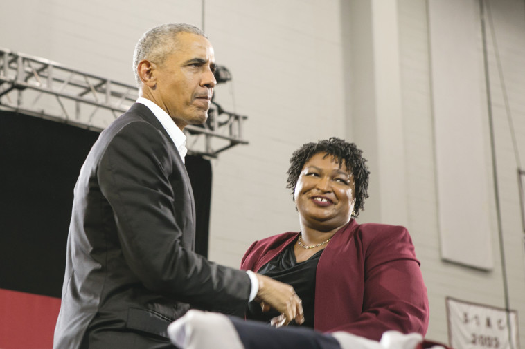 ברק אובמה וסטייסי אברמס. צילום: AFP