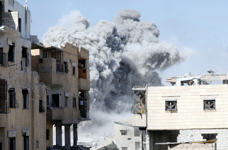 אזור מתקפה של כוחות הקואליציה נגד דאעש בסוריה. צילום: רויטרס