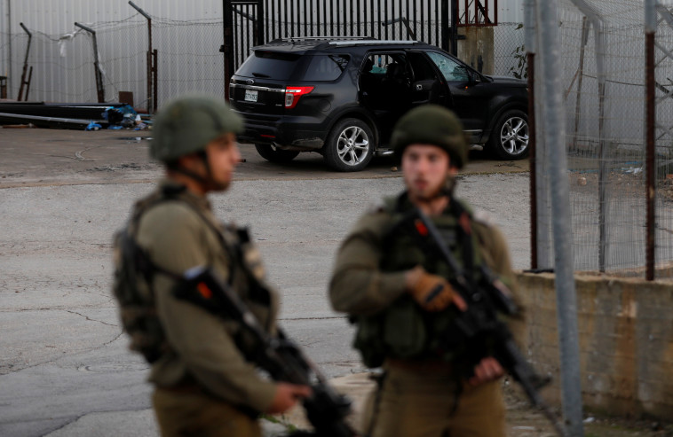 זירת הפיגוע בגבעת אסף. צילום: רויטרס