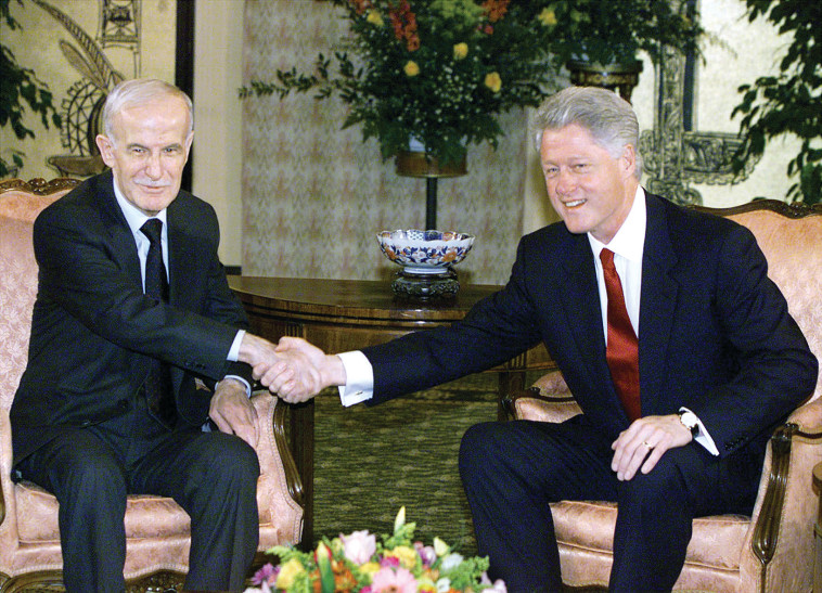 קלינטון ואסד