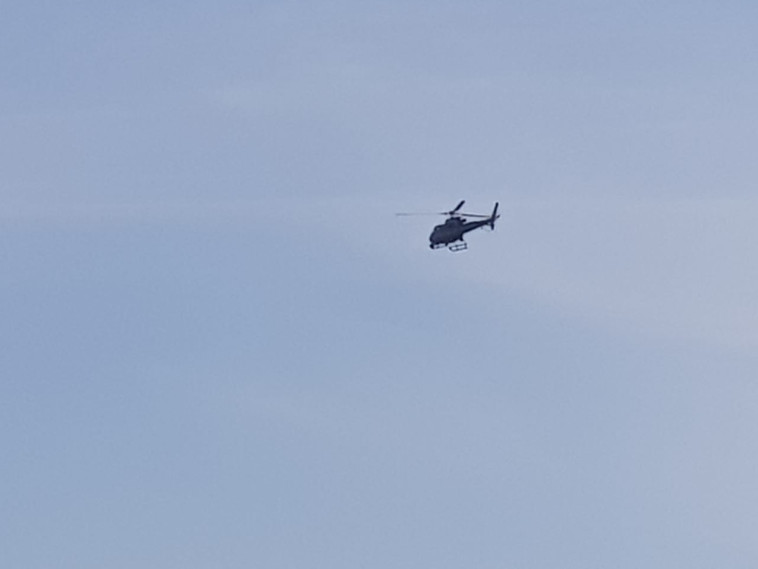 A helicopter at the scene of the incident on Road 6 (Photo: Alon Hachmon)