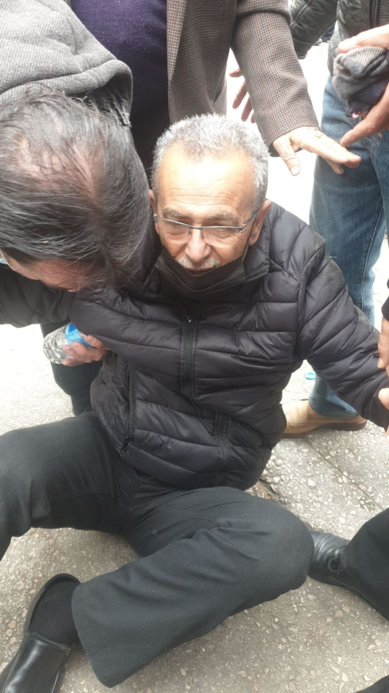 Former MK Jamal Zahalka was knocked to the floor during a demonstration in Nazareth (Photo: None)