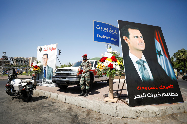 יום הבחירות לנשיאות סוריה, מפגן תמיכה בבשאר אסד (צילום: REUTERS/Omar Sanadiki)
