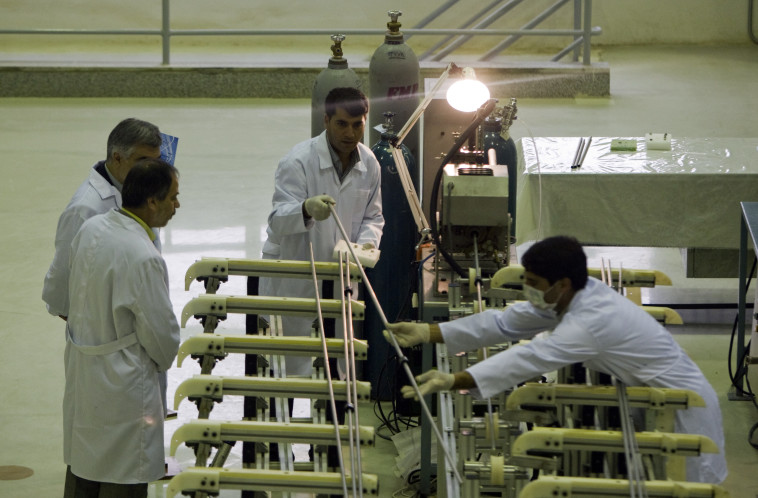 Workers at a nuclear facility (Photo: REUTERS / Caren Firouz)