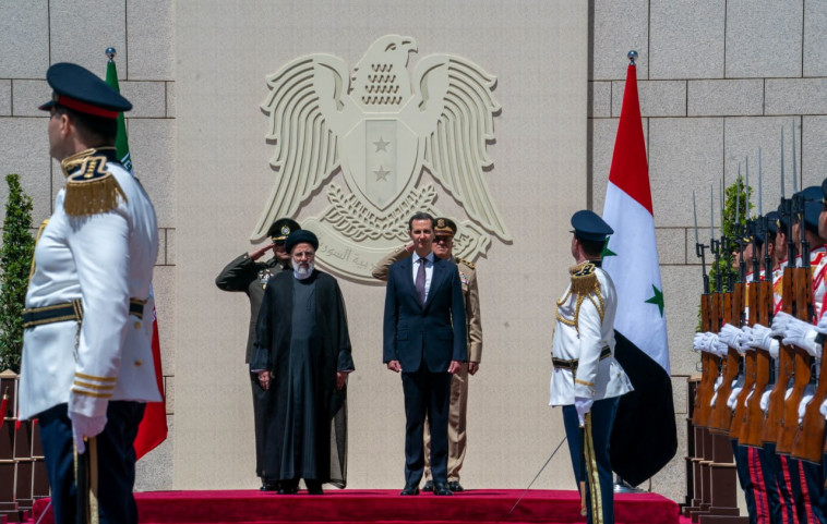 נשיא סוריה בשר אסד ונשיא איראן איברהים ראיסי (צילום: Handout via REUTERS)